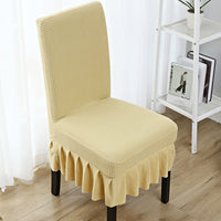 The chair cover has a skirt, is thick, stain-resistant, and elastic.