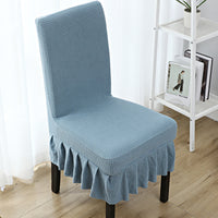 The chair cover has a skirt, is thick, stain-resistant, and elastic.
