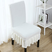 The chair cover has a skirt, is thick, stain-resistant, and elastic.